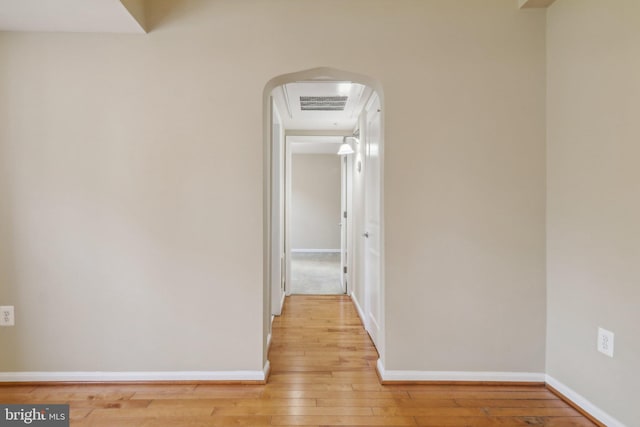 hallway with light wood-type flooring