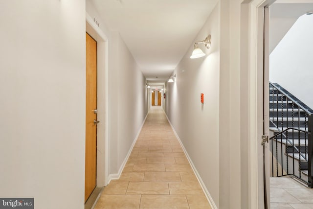 corridor featuring light tile patterned floors