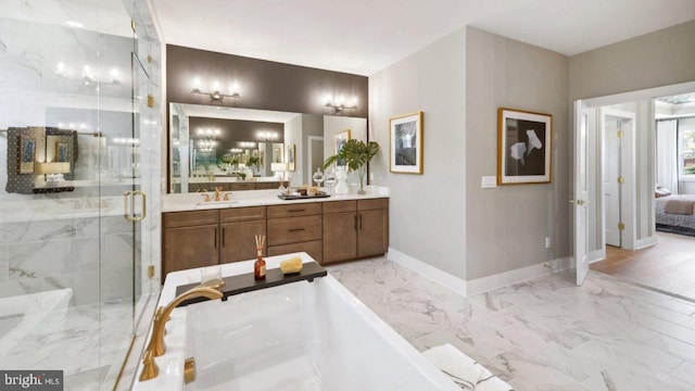 bathroom featuring vanity and a shower with door