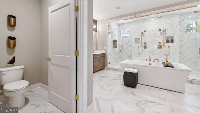 full bathroom featuring vanity, toilet, and separate shower and tub