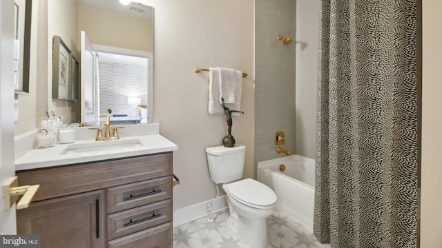 full bathroom featuring vanity, shower / bath combo, and toilet