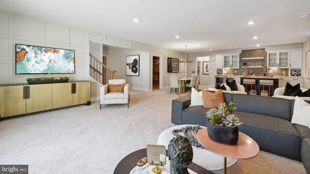 living room featuring light colored carpet