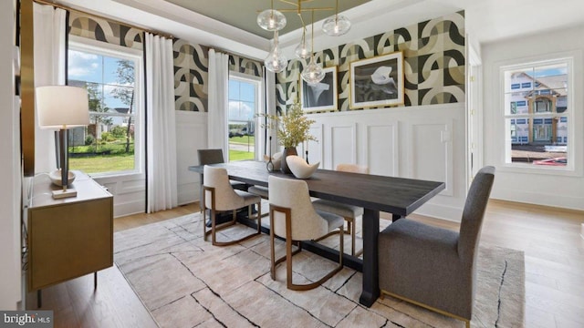 dining room featuring light hardwood / wood-style flooring and a healthy amount of sunlight