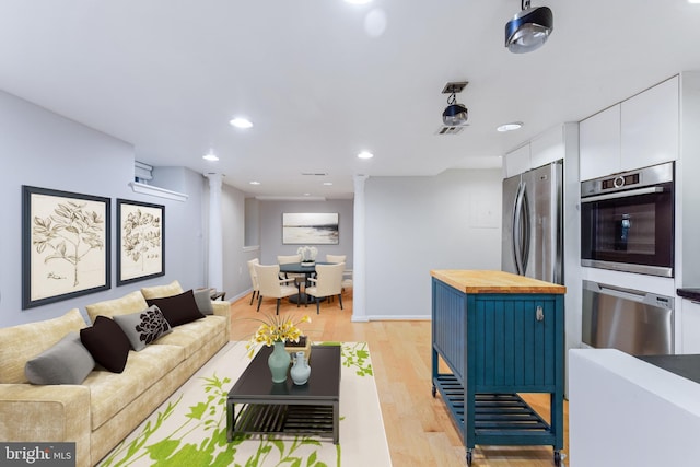 living room with light hardwood / wood-style flooring