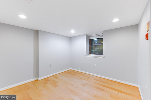 spare room featuring light hardwood / wood-style flooring