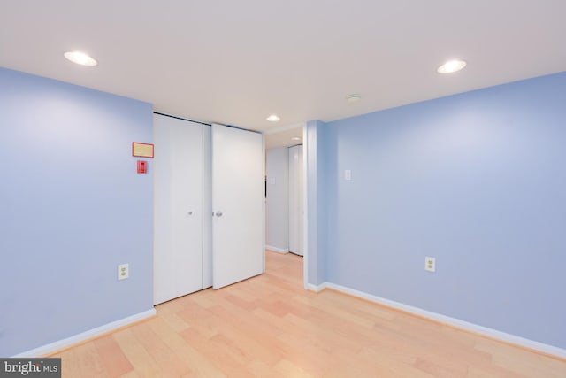 spare room featuring light wood-type flooring