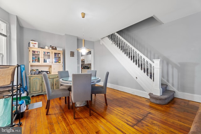 dining space featuring hardwood / wood-style floors