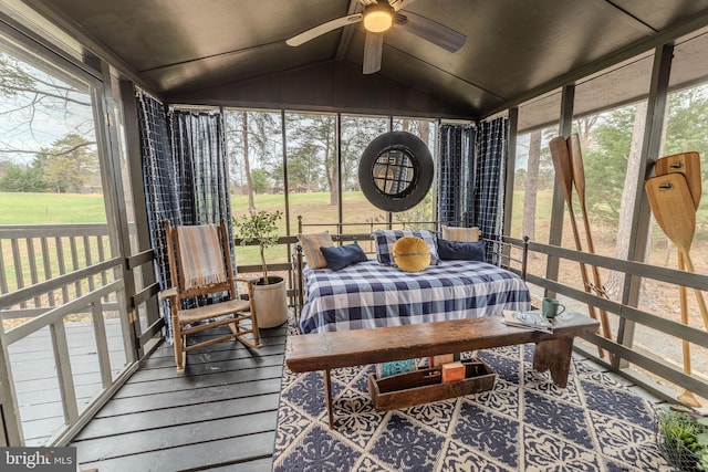 sunroom with vaulted ceiling, plenty of natural light, and ceiling fan