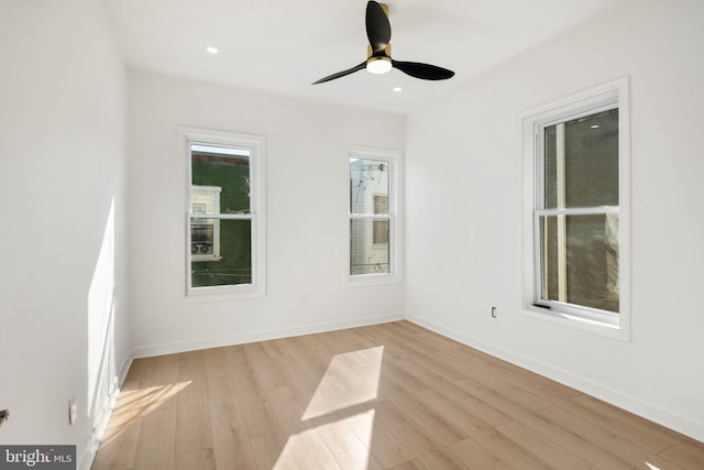 spare room featuring ceiling fan and light wood-type flooring