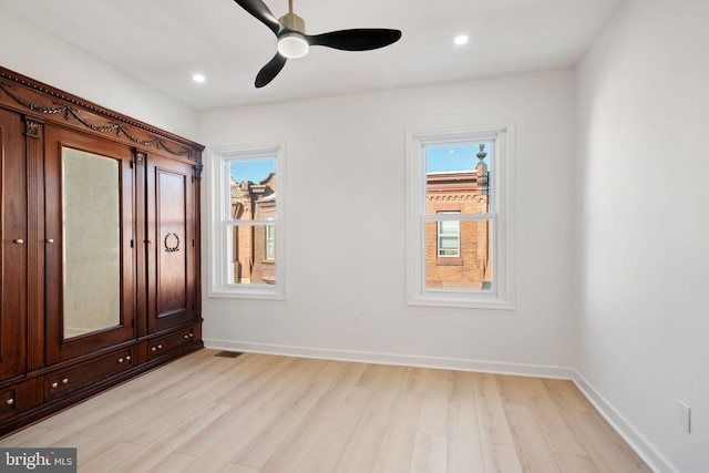 unfurnished bedroom featuring ceiling fan and light hardwood / wood-style floors