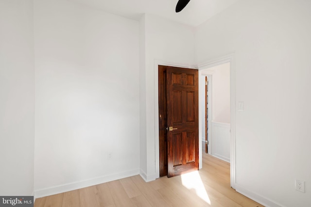 spare room with light hardwood / wood-style flooring and ceiling fan