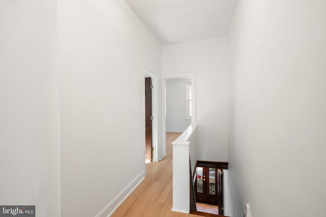 hall with light hardwood / wood-style floors