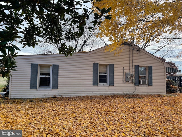 view of side of home with cooling unit