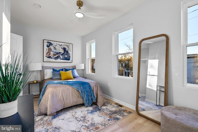 bedroom featuring ceiling fan and light hardwood / wood-style flooring