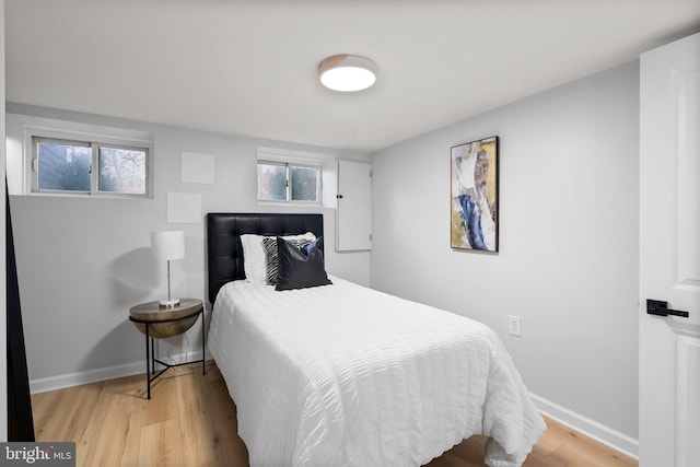 bedroom with light hardwood / wood-style flooring