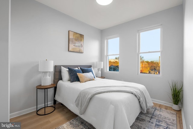 bedroom with light wood-type flooring