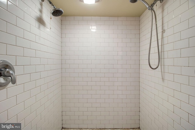 bathroom with tiled shower