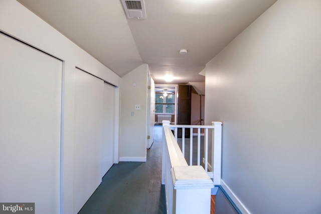 corridor with dark hardwood / wood-style floors