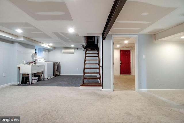 basement with separate washer and dryer, dark carpet, an AC wall unit, and sink