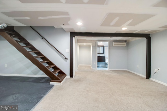 basement with carpet flooring and a wall mounted AC