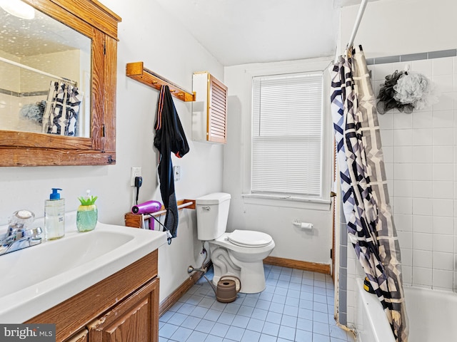 full bathroom with tile patterned floors, vanity, toilet, and shower / tub combo