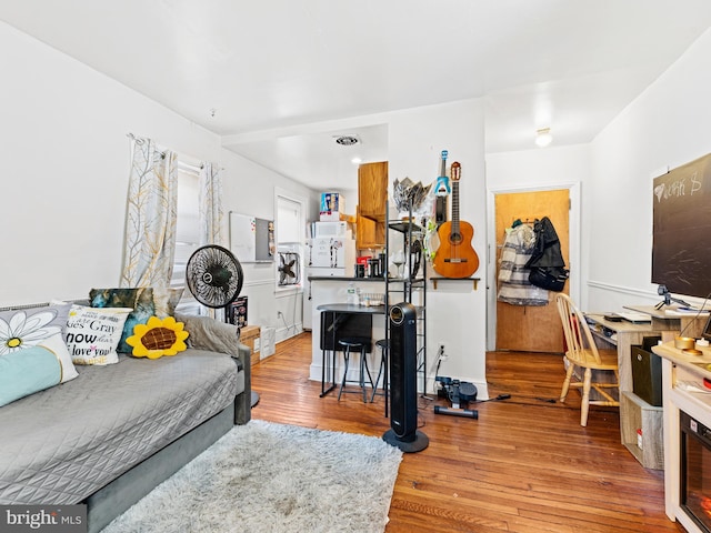 living room with light hardwood / wood-style flooring