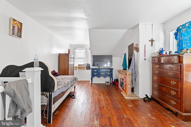 bedroom with hardwood / wood-style flooring