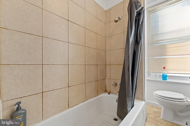 bathroom with tile patterned flooring and toilet