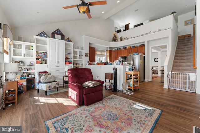 living room with beamed ceiling, ceiling fan, dark hardwood / wood-style flooring, and high vaulted ceiling