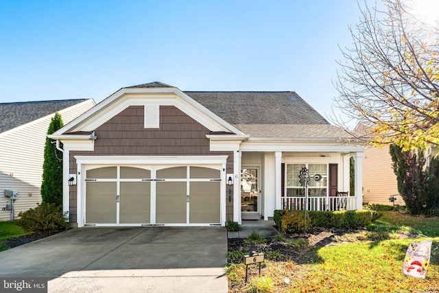 view of front facade with covered porch and a garage