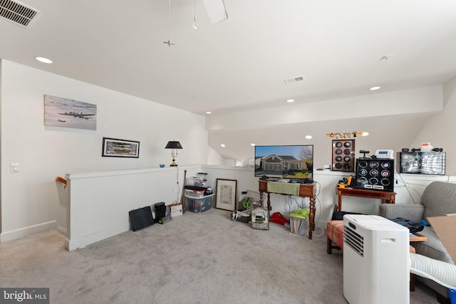 living room with light carpet and vaulted ceiling