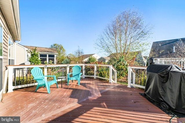 wooden terrace featuring grilling area