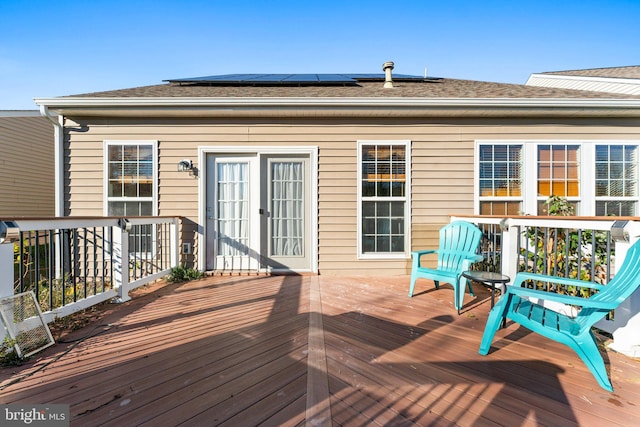 wooden deck featuring french doors