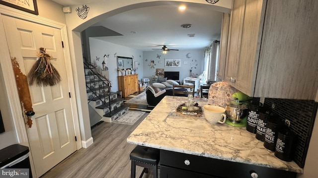 14 Buttonwood Rd, Stratford, NJ 08084 - kitchen with arched walkways, ceiling fan, wood finished floors, open floor plan, and baseboards