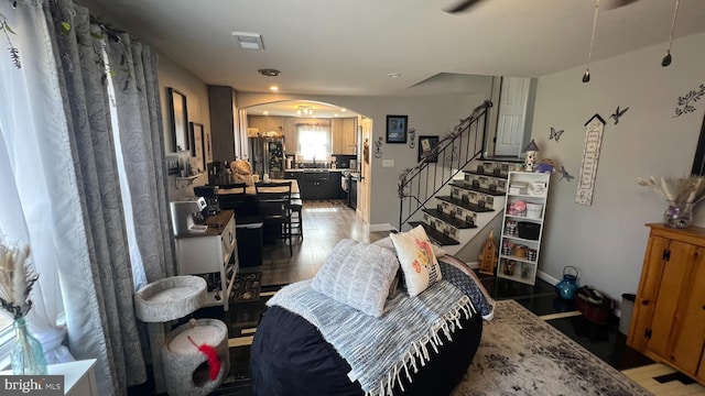 14 Buttonwood Rd, Stratford, NJ 08084 - living room featuring arched walkways, stairs, light wood-type flooring, baseboards, and recessed lighting