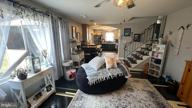 14 Buttonwood Rd, Stratford, NJ 08084 - living room with arched walkways, stairs, ceiling fan, and wood finished floors