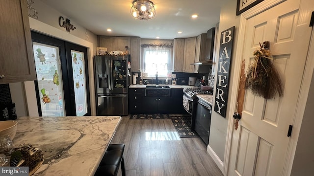 14 Buttonwood Rd, Stratford, NJ 08084 - kitchen with black fridge with ice dispenser, wall chimney exhaust hood, wood finished floors, dishwasher, and a sink