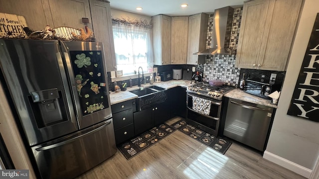 14 Buttonwood Rd, Stratford, NJ 08084 - kitchen with appliances with stainless steel finishes, wall chimney range hood, a sink, wood finished floors, and tasteful backsplash