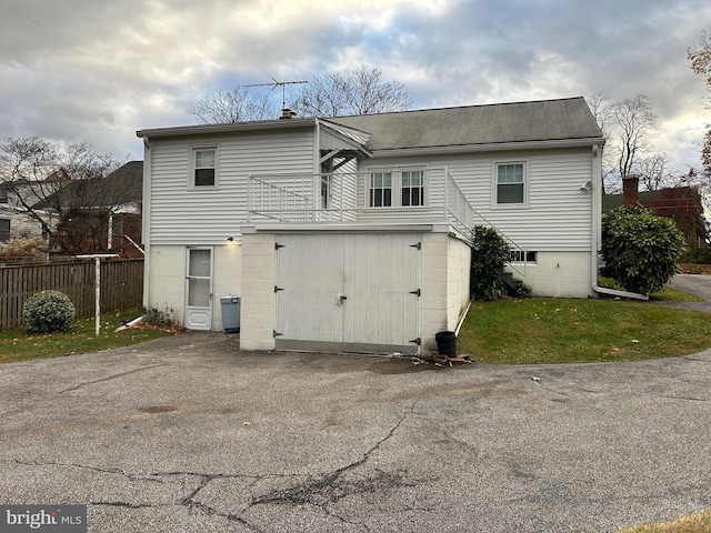 back of property with a balcony