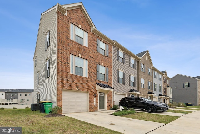 view of property with central AC and a garage