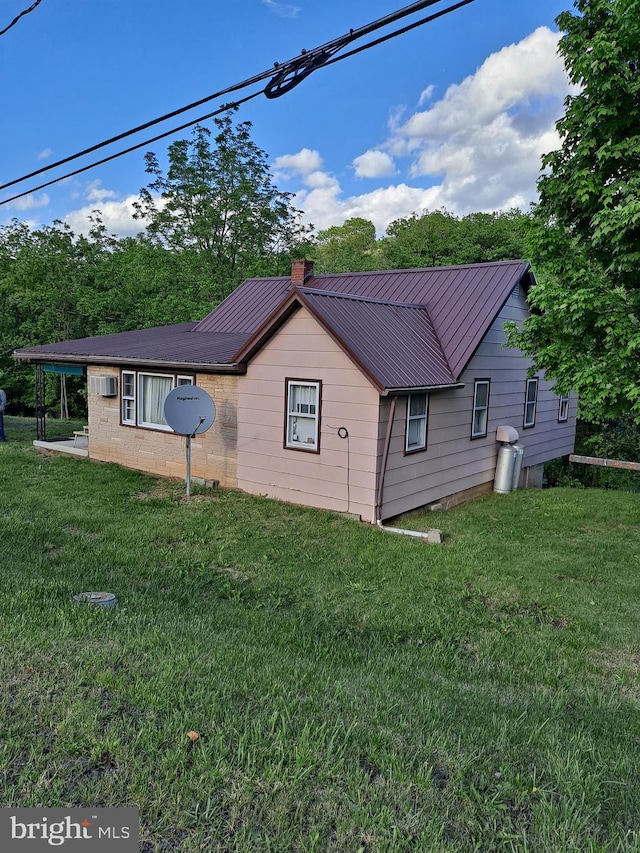 view of property exterior featuring a yard