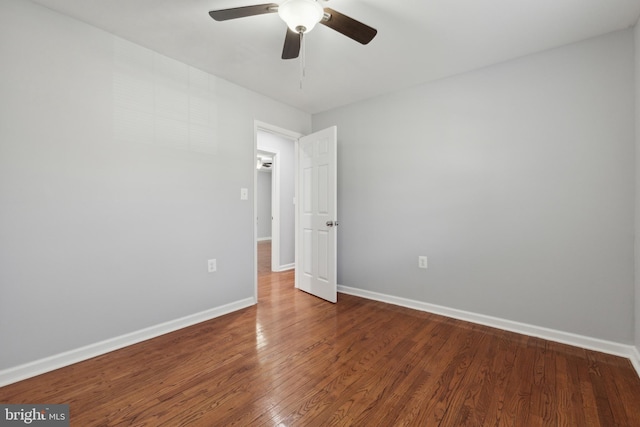 spare room with ceiling fan and hardwood / wood-style floors