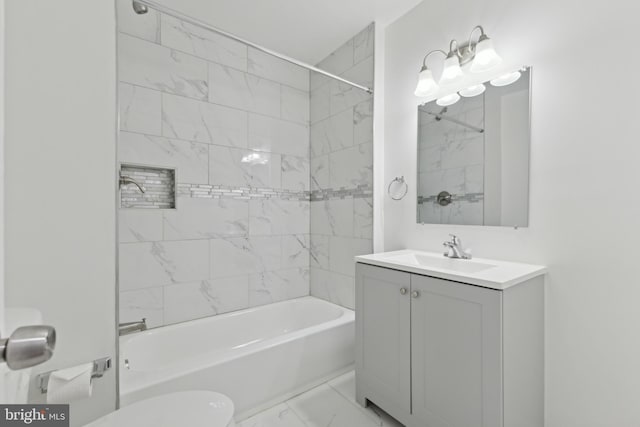 full bathroom with tiled shower / bath combo, toilet, and vanity