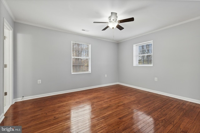 unfurnished room with hardwood / wood-style flooring, a healthy amount of sunlight, and crown molding