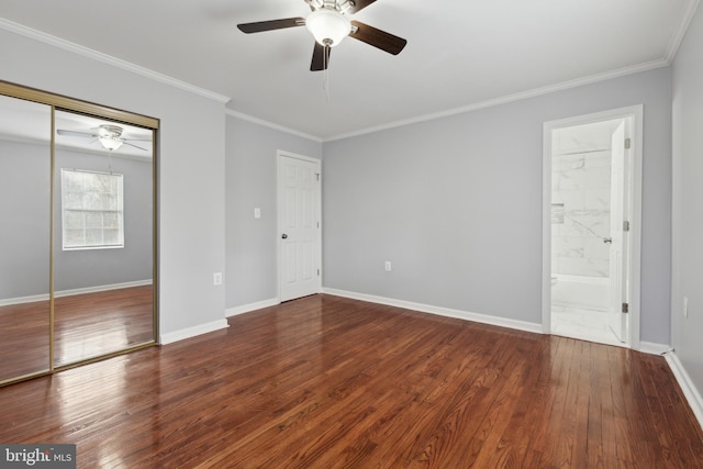 unfurnished bedroom with ceiling fan, crown molding, ensuite bathroom, and hardwood / wood-style flooring