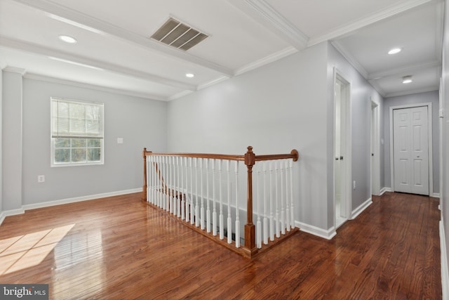 corridor featuring beam ceiling, dark hardwood / wood-style flooring, and ornamental molding