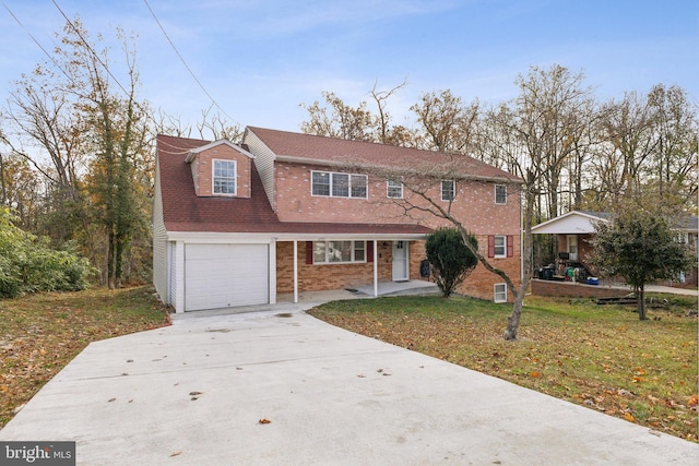 view of front facade with a front yard and a garage