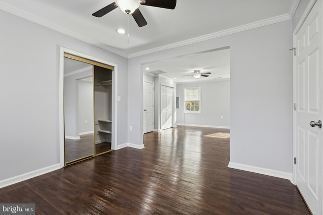 unfurnished bedroom featuring crown molding, ceiling fan, and dark wood-type flooring