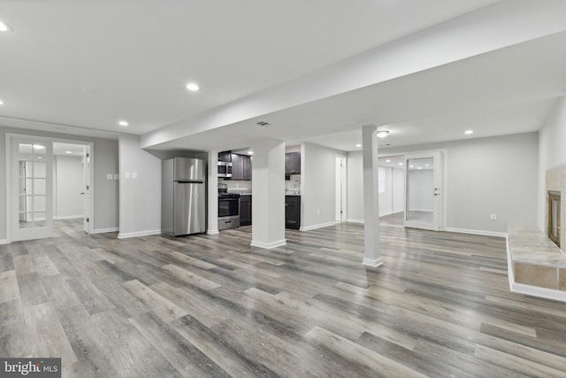 unfurnished living room with light hardwood / wood-style flooring