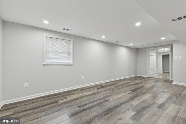 spare room with hardwood / wood-style floors